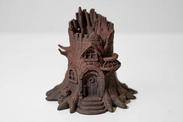 3D-printed miniature treehouse model on a white background